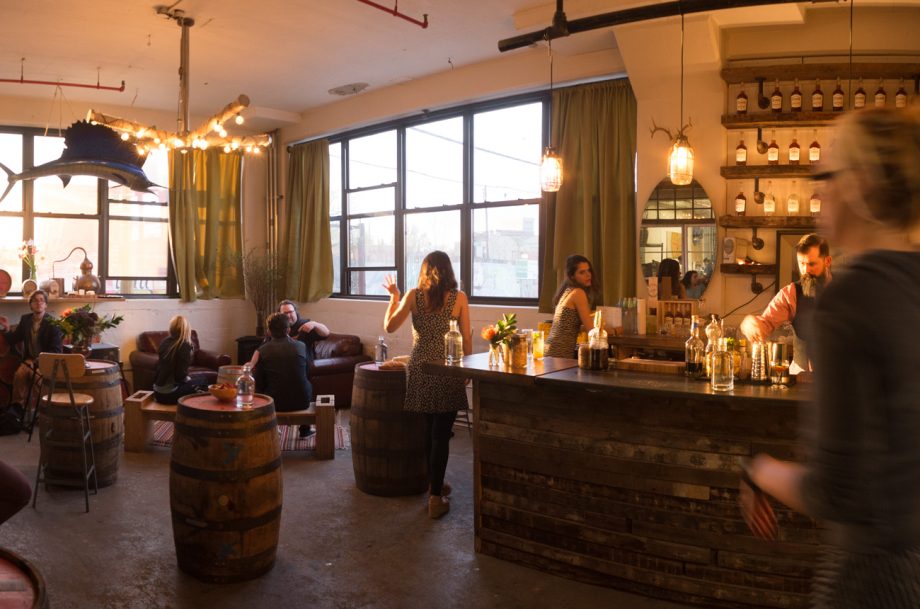 A well lit bar with people having a good time